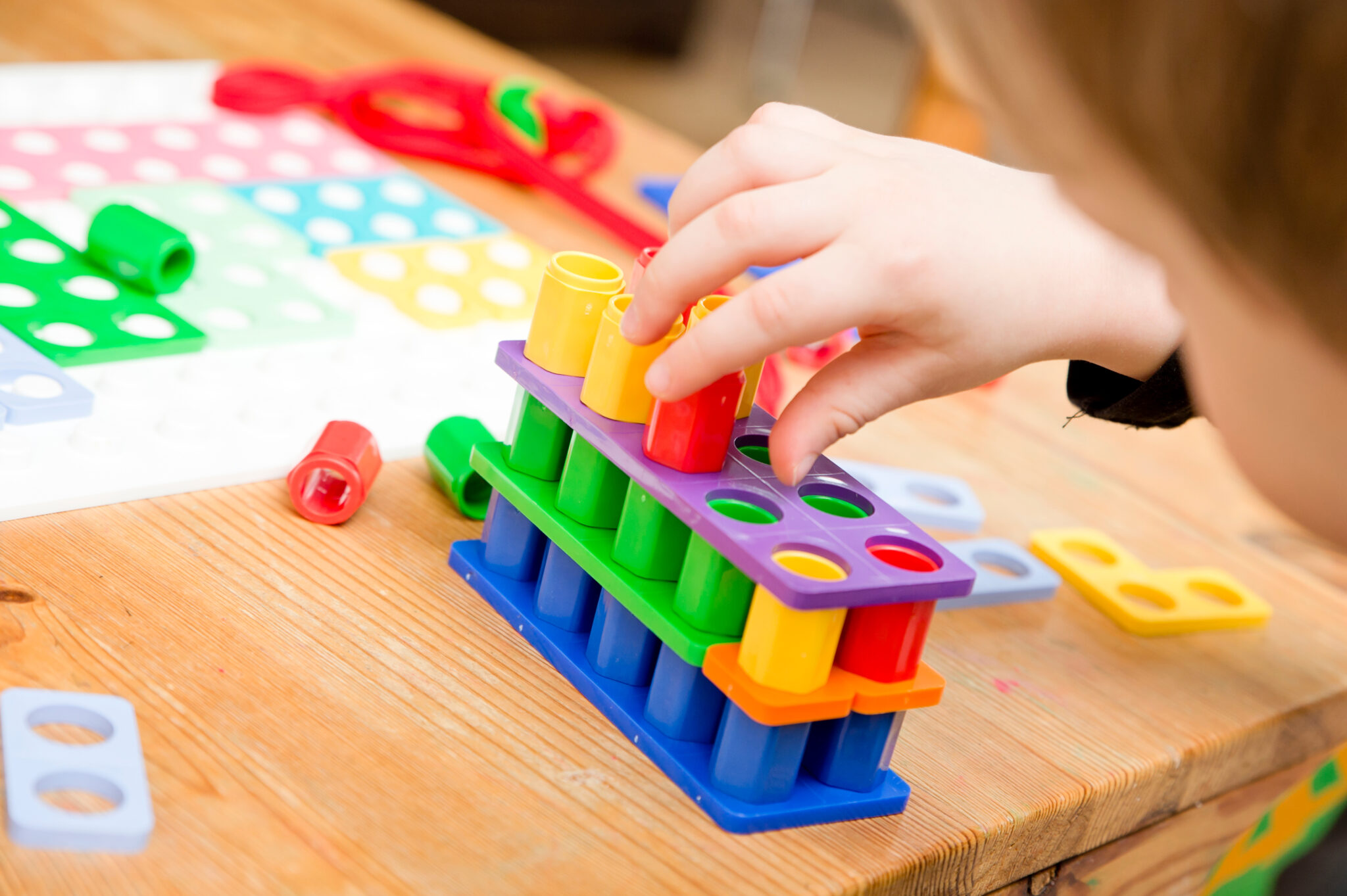 kids hand on figures. learning to count through the game. tool to easy learn add and subtract, divide and multiply, master math understanding, sense of pattern, experience it through hands and eyes.